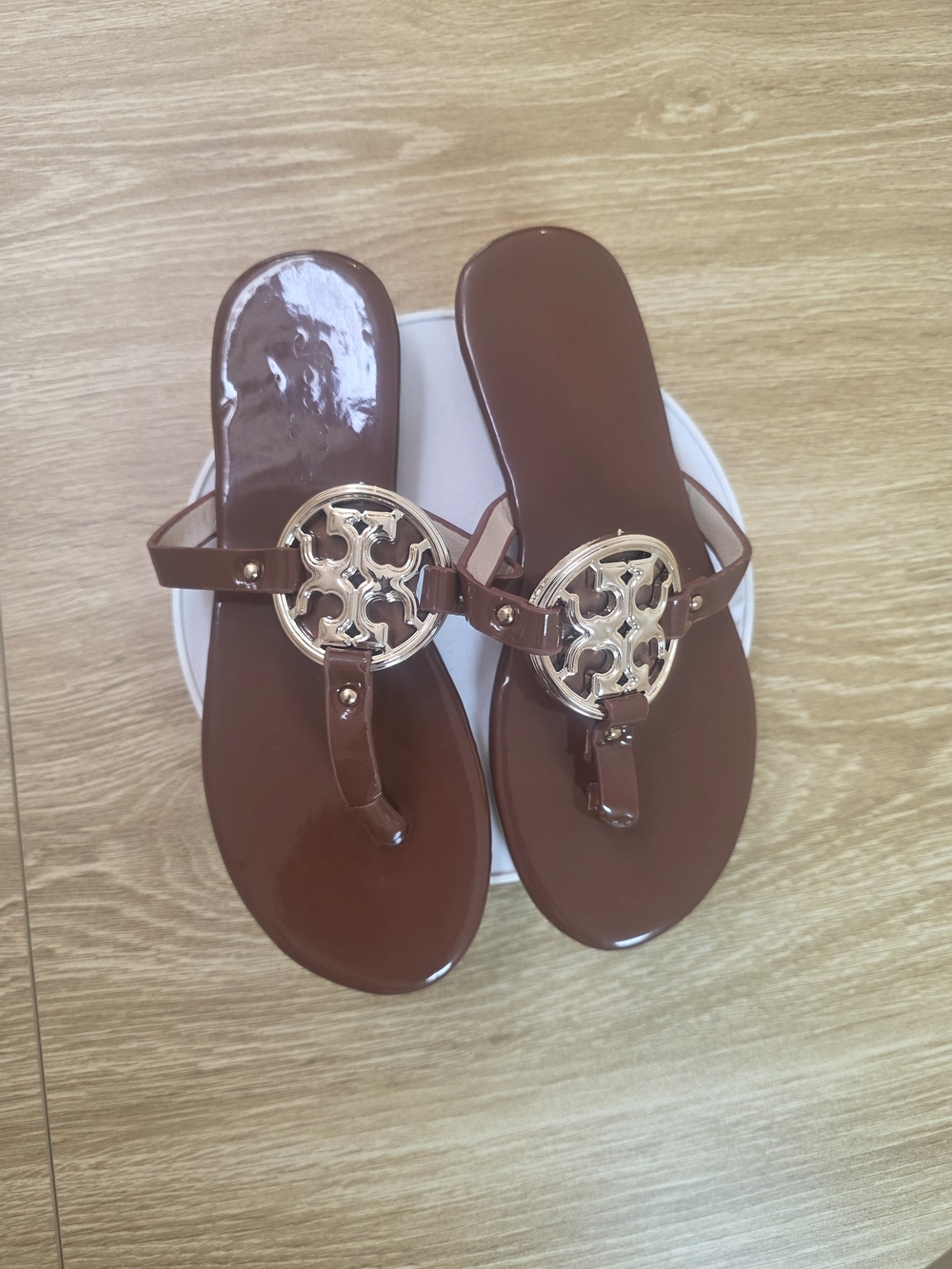 Brown Women's Jelly Thong Sandals with Gold Emblem